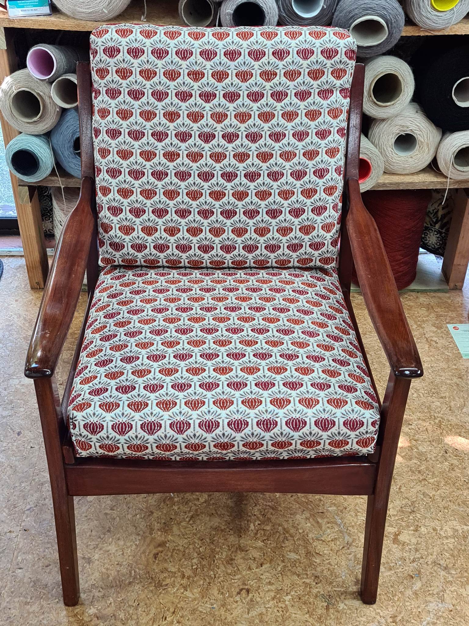 Mid-century armchair reupholstered with custom fabric